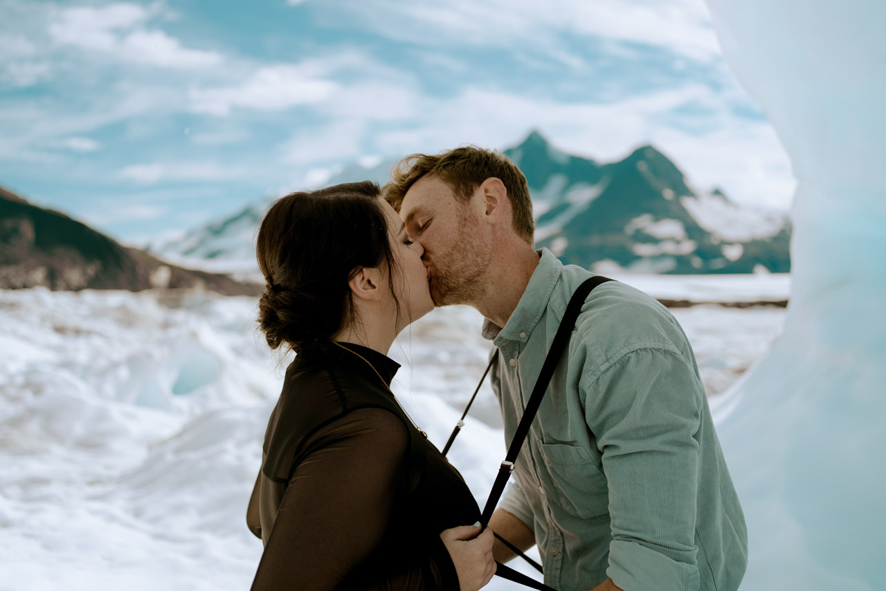 adventure elopement alaska ice arch ceremony kiss