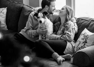 couples session home married cozy couch laughing family dog