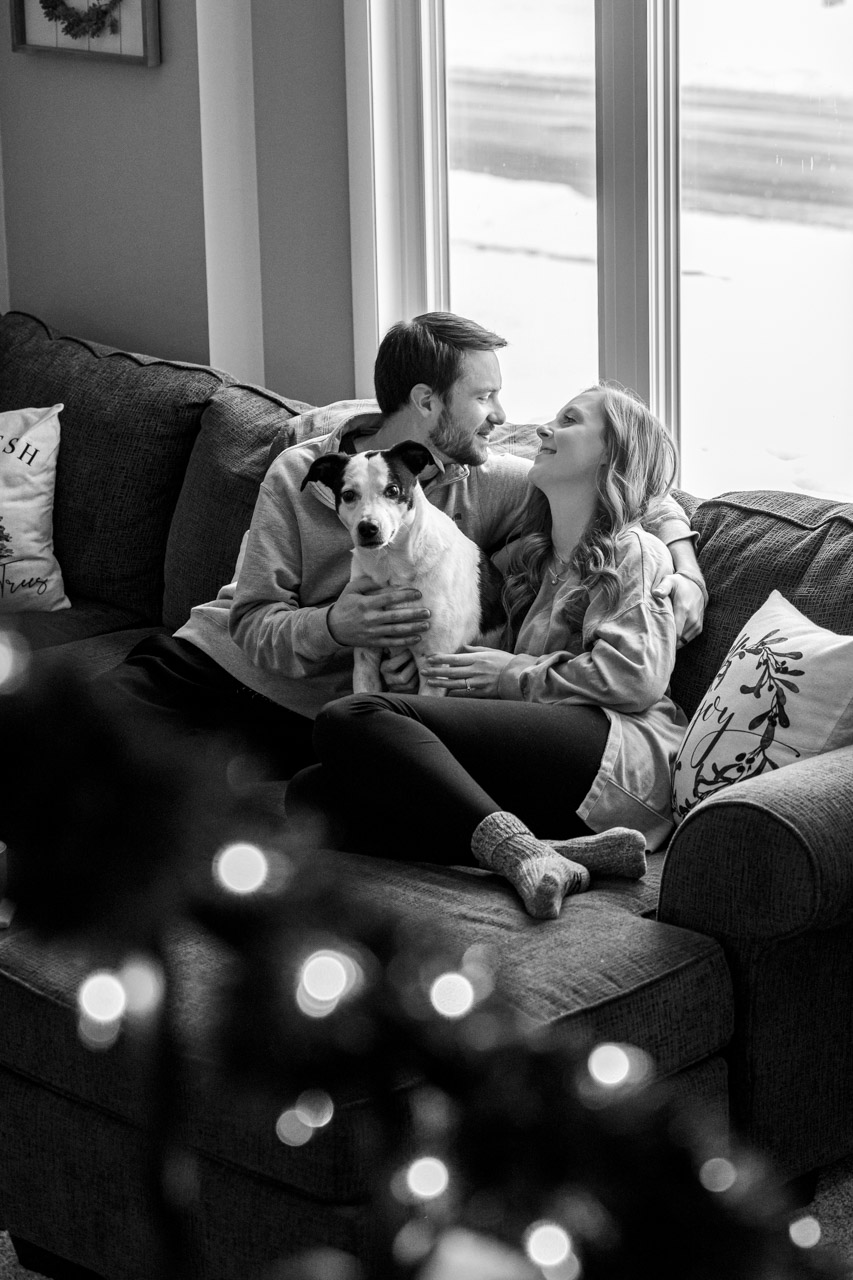 couples session home married cozy couch laughing family dog