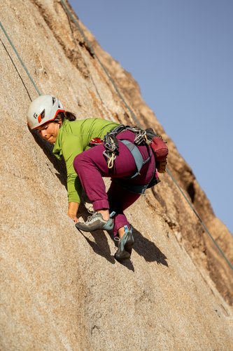 rock climber in joshua tree national park on a she moves mountains retreat