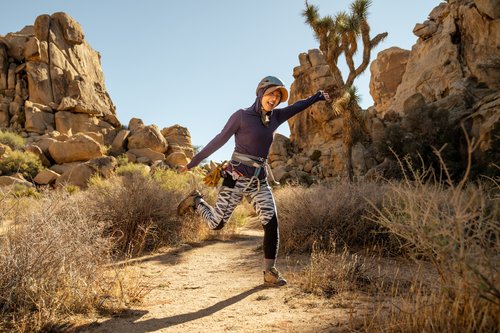 female climber in joshua tree national park in she moves mountains retreat